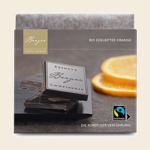 Bio Edelbitter Orange – Tafelschokolade von Confiserie Berger, 90 g, freigestellt vor cremefarbenem Hintergrund