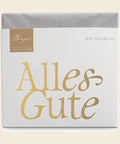 Thementafel Bio Vollmilch "Alles Gute" – Tafelschokolade von Confiserie Berger, 70 g, freigestellt vor cremefarbenem Hintergrund