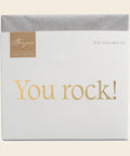 Thementafel Bio Vollmilch "You Rock" – Tafelschokolade von Confiserie Berger, 70 g, freigestellt vor cremefarbenem Hintergrund