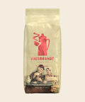 Hausbrandt Espresso Nonnetti – Espresso, 1000 g, freigestellt vor cremefarbenem Hintergrund
