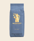 Hausbrandt Gourmet – Espresso, 1000 g, freigestellt vor cremefarbenem Hintergrund