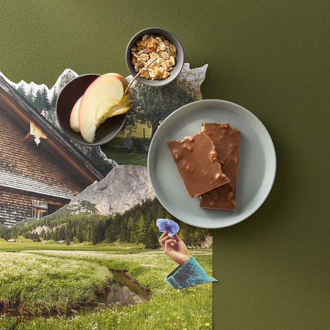 Bio Schokoladentafel Vollmilch mit Müsli und Apfelstückchen – Schokolade von Confiserie Berger, 90 g, angerichtet