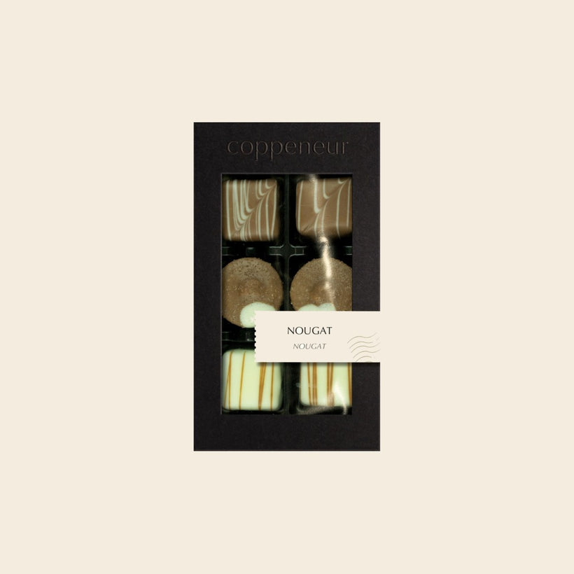 6er Sélection Nougat von Coppeneur – Pralinenschachtel auf cremefarbenem Hintergrund