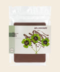 Viel Glück – Tafelschokolade von Art of Chocolate, 120 g, freigestellt vor cremefarbenem Hintergrund
