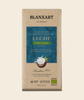 BLANXART Chocolate con Leche Vegana de Coco – Schokoladentafel 75 g, freigestellt auf Creme