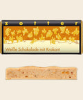 Weiße Schokolade mit Krokant – handgeschöpfte Schokolade von Zotter, freigestellt